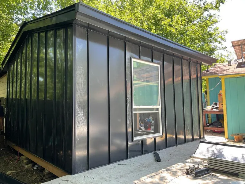 Black standing seam metal wall panels for Roof Inspection in Gallatin