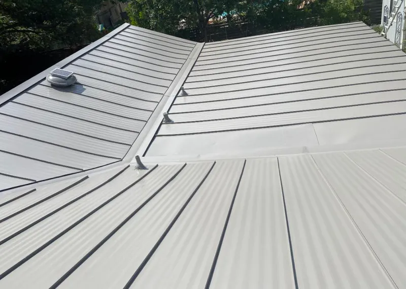 Solar attic fan installed on a metal roof for Roof Ventilation in Gallatin